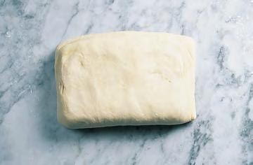 Form the butter into a rectangle two-thirds the size of the dough, leaving room around the edges, and place on