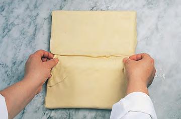 Before rolling, beat the dough lightly as shown so the butter is evenly distributed.