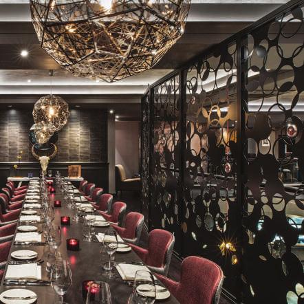 Floor to ceiling panelling separates this room from the main restaurant, whilst