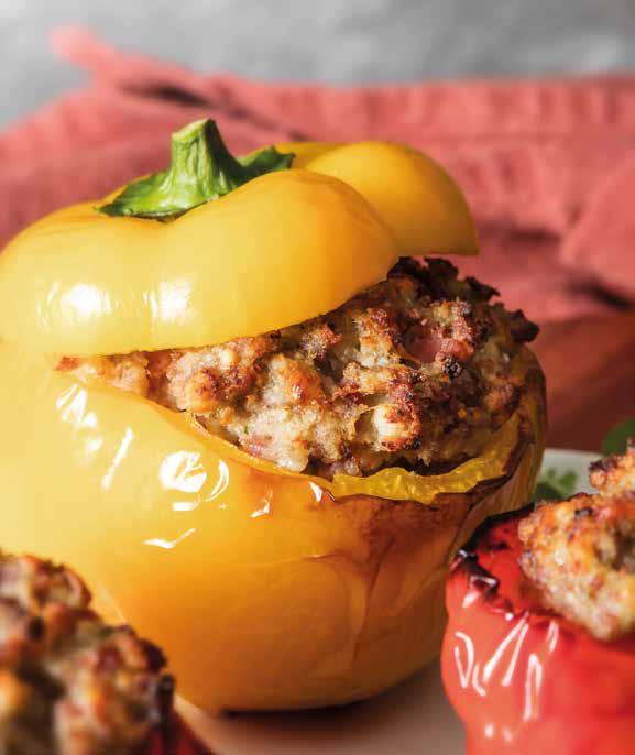 24 4 medium sized peppers 150 g of sausage meat 150 g of minced beef 150 g of cooked ham, chopped 200 g stale or sliced bread 50 g of Ceder cheese, roughly chopped milk as required 2 cloves of garlic