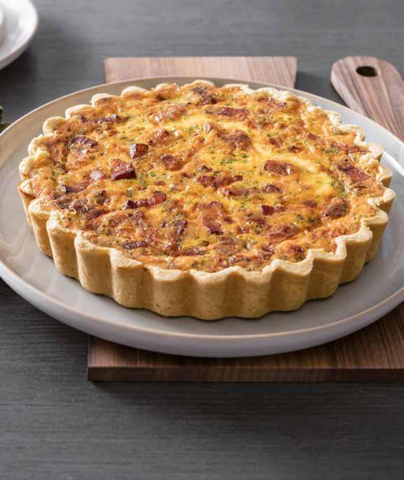 28 250 g of fresh shortcrust pastry 150 g of bacon, diced 4 eggs 2 onions cut into julienned pieces 10 g of chopped parsley 200 ml of milk 200 ml of single cream 100 g of roughly grated gruyère