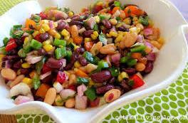 garlic 1/4 cup chopped fresh cilantro 1/2 tbs ground cumin 1/2 tbs ground black pepper 1 dash hot pepper sauce 1/2 tsp chili powder In a large bowl, combine beans, bell peppers, frozen corn, and red