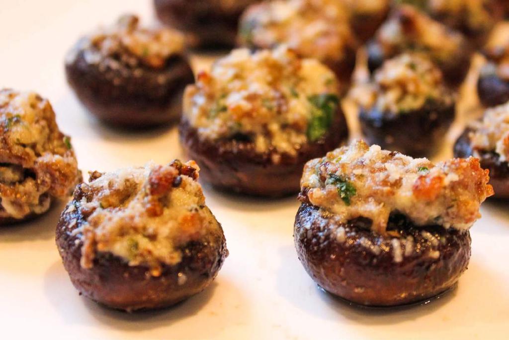 BOURSIN & SAUSAGE STUFFED MUSHROOMS TIME 35 min. YIELD 20-30 pieces PREHEAT oven to 400 F 1½ lb. medium white or crimini mushrooms olive oil for drizzling 1 tbsp. olive oil ½ lb.