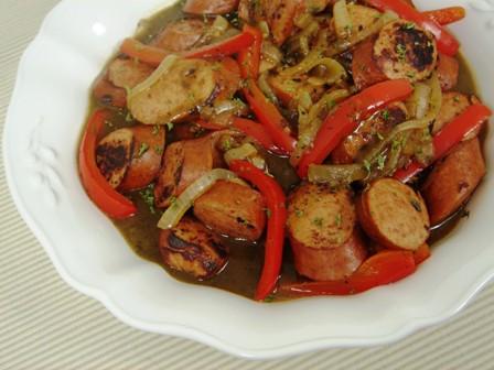 Italian Sausage and Capsicums 4 Italian sausages (or preferred flavour) 4 assorted capsicums (sliced) 1 large onion (julienne) 1 tablespoon Olive Oil 3 garlic cloves (chopped finely) ¼ teaspoon