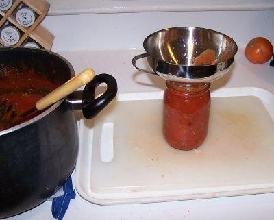 Step 9 - Fill the jars with sauce and put the lid and rings on Fill them to within ¼-inch of the top, seat the lid and hand-tighten the