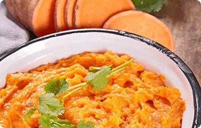 Sweet Potato Mash 1 1/4 pounds (about 4) sweet potatoes, peeled and chopped 5 garlic cloves, peeled 3 tablespoons fat-free sour cream 1 tablespoon olive oil 1/8 teaspoon salt 1/8 teaspoon freshly