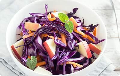 Harvest Slaw 2 cloves garlic, minced 2 teaspoons caraway seeds 3 tablespoons olive oil 1/4 cup cider vinegar 1 tablespoon honey 1/4 teaspoon salt 1/8 teaspoon pepper 4 cups red cabbage, finely
