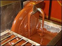 PRESSING AND PULVERIZING After heat treatment, cocoa liquor is pressed by high pressure hydraulic presses. Cocoa butter is squeezed out of the cocoa liquor and is collected separately.