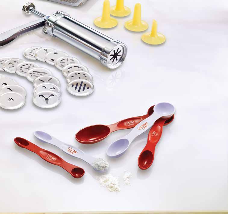 professional pastry chef. Stainless steel cookie press includes 20 steel disks and 4 plastic tips for decorating. 8 high. $21.