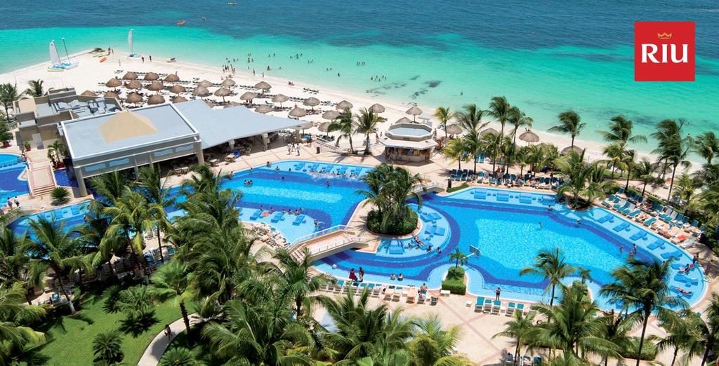 Hotel Riu Cancun This 4 star, all-inclusive. Resort is located in the heart of Cancun and set on a beach of white sand and turquoise water. Resort offers buffets and 6 themed restaurants.