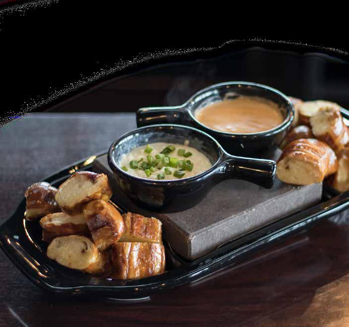 GREAT BEGINNINGS BLACK ROCK TM DUELING PRETZEL & CHEESE FONDUE TM Soft pretzels served with house made white garlic cream cheese and a nacho cheese fondue served on our volcanic stone 9.