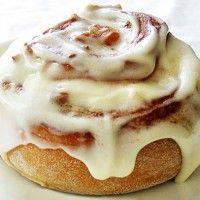 Drizzle the glaze over the rolls and serve warm.