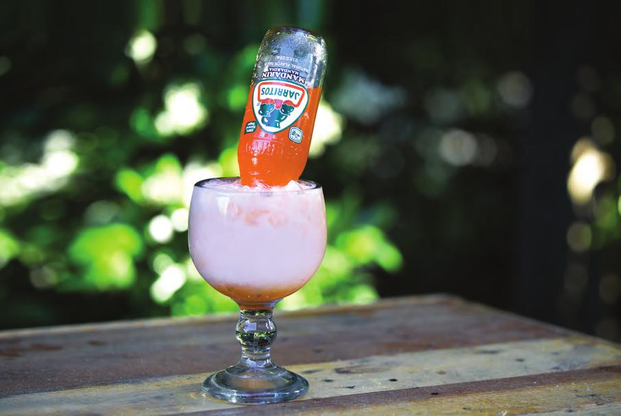JARRICHATA 1½ oz of Vodka Jarritos Pineapple or Jarritos Mandarina Horchata Ice In a large glass with a wide opening (chabela) rim with sugar.
