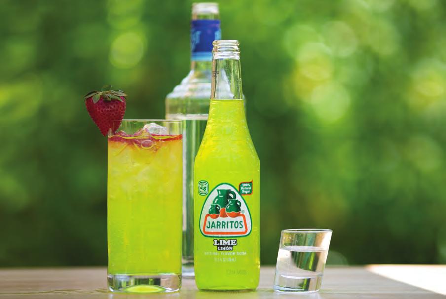 CITRUS BAY COOLER Tall glass filled with ice 1½ oz Coconut Rum Jarritos Lime Strawberry Fill glass with ice, add