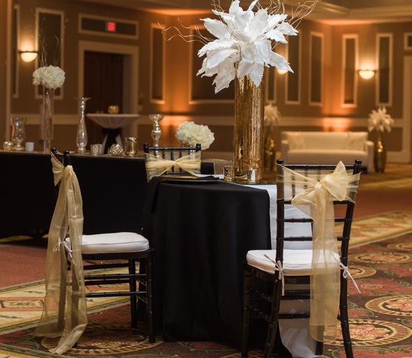 DELUXE Beautiful Event Space, Furniture, and Fixtures Tables, chairs, custom dance floor, and custom staging and Sophisticated. A truly elegant affair.