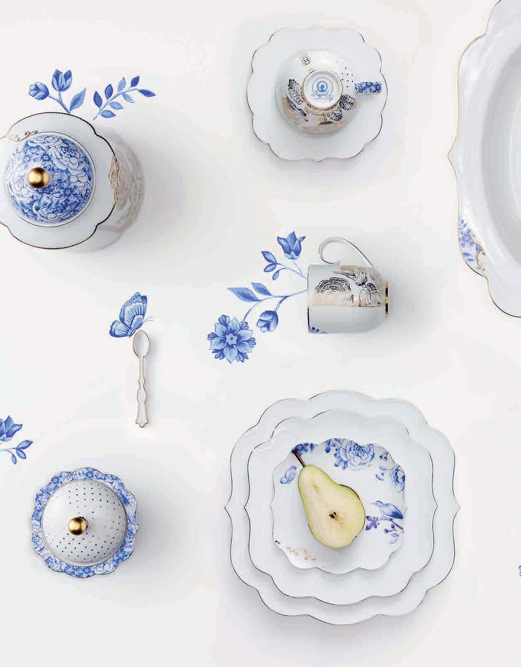 golden floral scenes, alternating with golden graphic elements, all of which are also found in the Royal tableware collection.