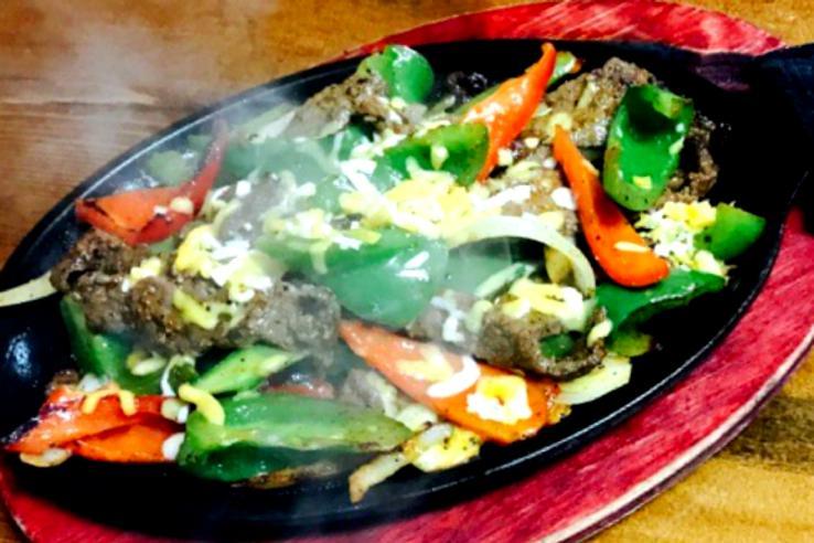 FAJITA SKILLETS Served sizzling with sautéed garden-fresh vegetables on a cast iron skillet. Accompanied by beans, rice and tortillas.