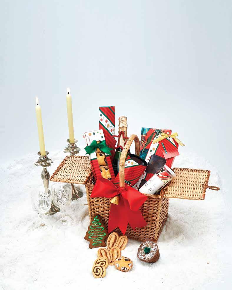 XMAS IN A BASKET Packed neat in a traditional wicker lidded basket, these goodies can complete any celebration.