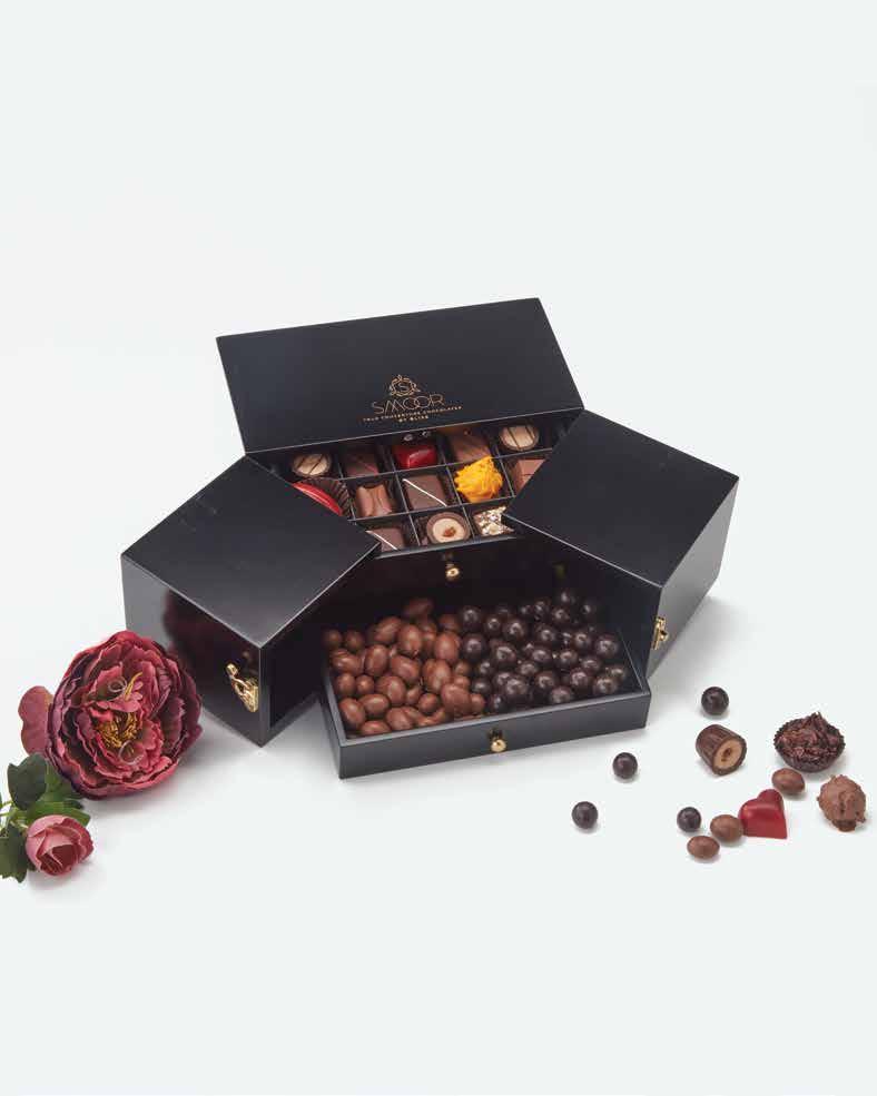 BLACK BEAUTY An exotic collection of couverture chocolates and coated nuts within a masterpiece.
