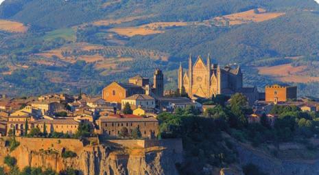 The surrounding landscape is one of Europe' s most dramatic, and is home to Orvieto Classico wine, also famous world-wide.