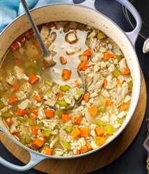 Bring to a boil and skim surface of accumulated foam. Simmer on low heat for about 40 minutes. Add carrots, celery, and onion and simmer for another 15 minutes. Add spinach and barley.