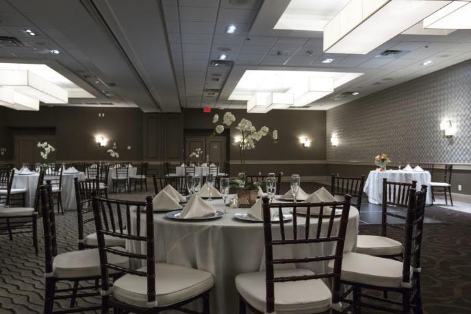 The neutral palette and sleek new dance floor provide the perfect backdrop for your color theme.