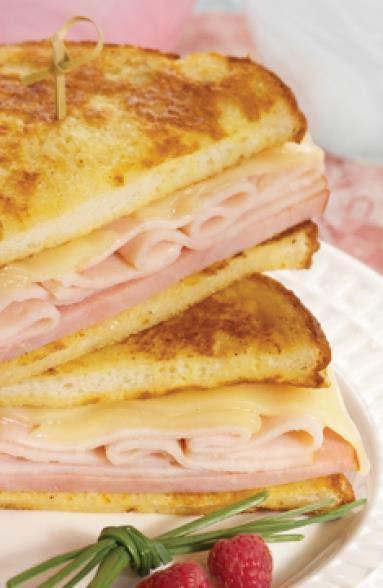 Step 2: To assemble single serving: Place 1 slice bread on flat work surface; top with 2 oz. ham, 3 oz. turkey and 2 cheese slices.