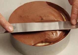 <still in their bags or are they emptied out?> Meanwhile, make the chocolate discs: 3 Mix together the tempered chocolate and the almond oil in a bowl.