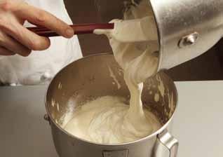 5 Carefully fold one-third of the mixture into the melted chocolate and then fold in the