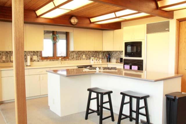 KITCHEN/BREAKFAST AREA: 20 X 14 Whether you are creating a meal yourself or with a visiting chef, this professional kitchen features a large preparation island to accommodate a full cooking staff