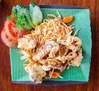 North-eastern Thailand with shredded green papaya mixed with fresh chilli, garlic, green bean, tomato, preserved salty crab, salty fish, fish sauce and