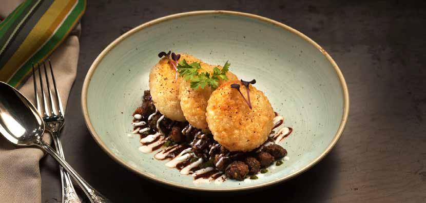 and cashews, encased in an Indian pastry shell ALOO TIKKI 26 Crispy fried, sago crusted spiced potato cakes, lentil and mint