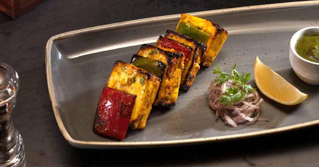 Cottage cheese cubes stuffed with mango pickle, grilled pepper and onion SOYBEAN KEBAB 40
