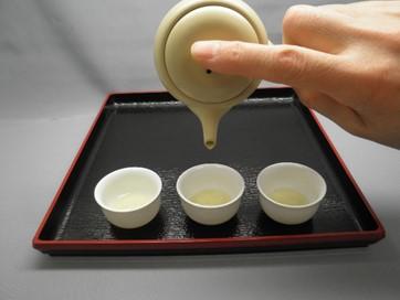 This is called mawashitsugi in Japanese, and if you have 3 cups, pour it in the order of 1, 2, 3 and then back 3, 2, 1, repeating this until you have