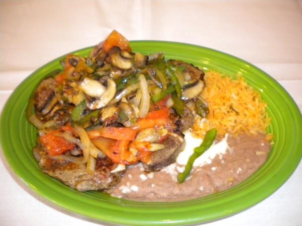Served with guacamole, sour cream, lettuce, rice, beans and tortillas. Pollo a la Mexicana - 8.59 Two chicken breasts with onions, tomatoes, jalapenos and mushrooms.