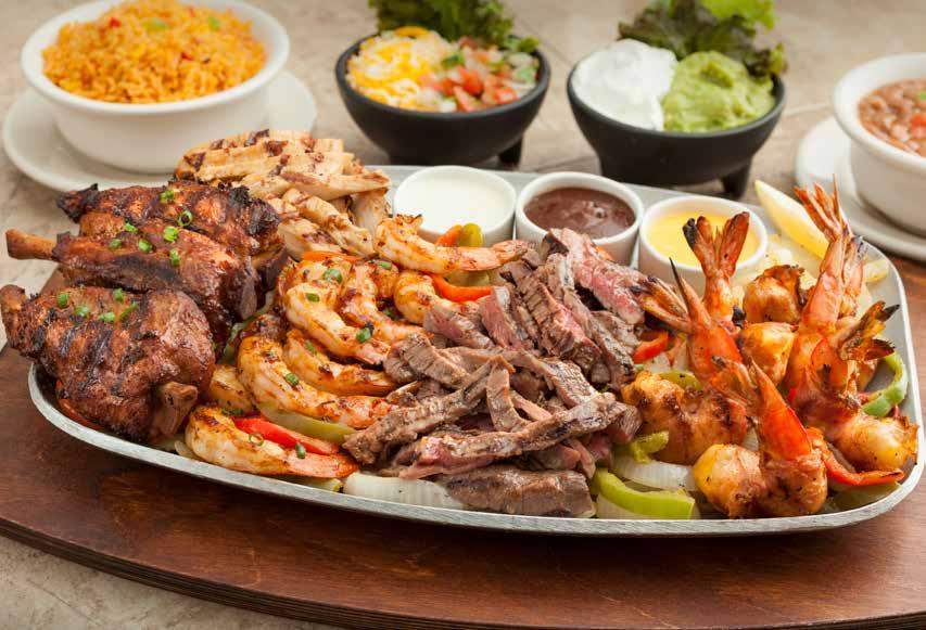 FABULOUS FAJITAS Fire-grilled fajitas served with sizzling grilled onions and peppers, Mexican rice, our famous charro beans, fresh, homemade guacamole, sour cream, cheese and pico de gallo.