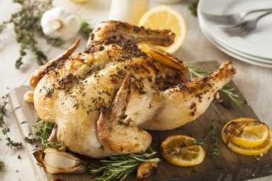 Garlic Herb Roasted Chicken Servings: 8 Net Carbs: 2g 1 (5-pound) roasting chicken 1 head garlic, unpeeled 2 sprigs fresh rosemary 2 sprigs fresh thyme 2 tablespoons olive oil 3 cloves minced garlic
