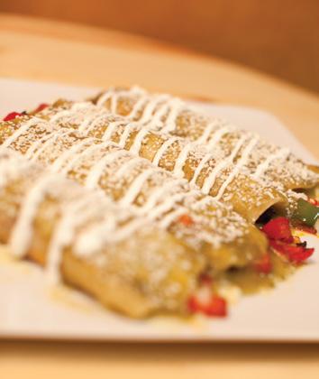 VEGETARIAN ENCHILADAS VEGETARIANAS Two traditional enchiladas topped with green tomatillo sauce and special Mexican cheese, filled of fresh grilled vegetables: mushrooms, red and green peppers and
