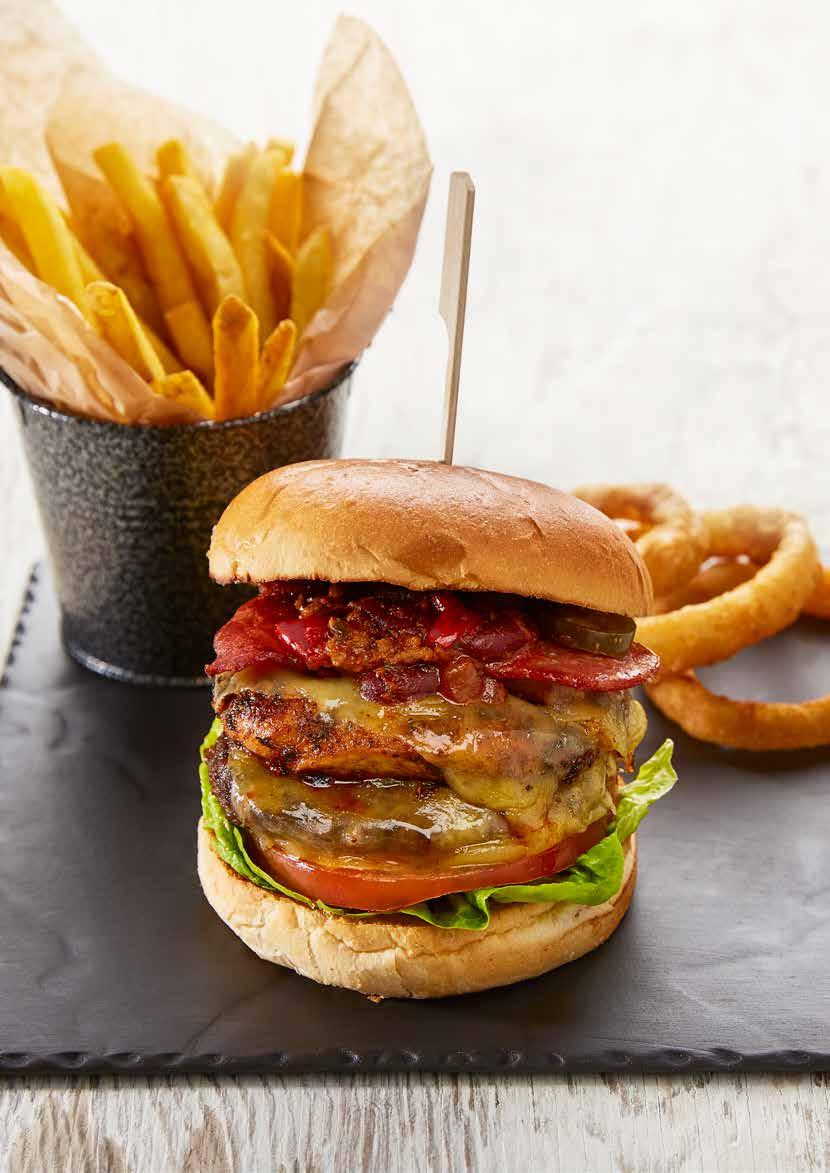 THE ULTIMATE BURGER burgers A REAL TASTE OF STATESIDE! ALL OUR BURGERS ARE FLAME GRILLED & SERVED IN A BRIOCHE BUN LOADED WITH LETTUCE, TOMATO & ONION & SERVED WITH SKIN ON FRIES.