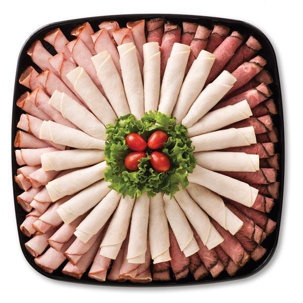 Artfully arranged platter of thinly sliced roast beef, ham and turkey. (S) 8-12 Servings $39.