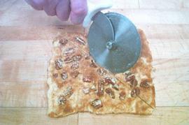 Step : Take a pizza cutter or knife and cut the 5x5 square in half