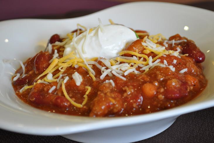 Chili Cost: 6.95 per person Includes Warm Bread Bowl Cheddar Cheese Diced Onions Jalapeños Fritos Sour Cream Vegetarian chili available.
