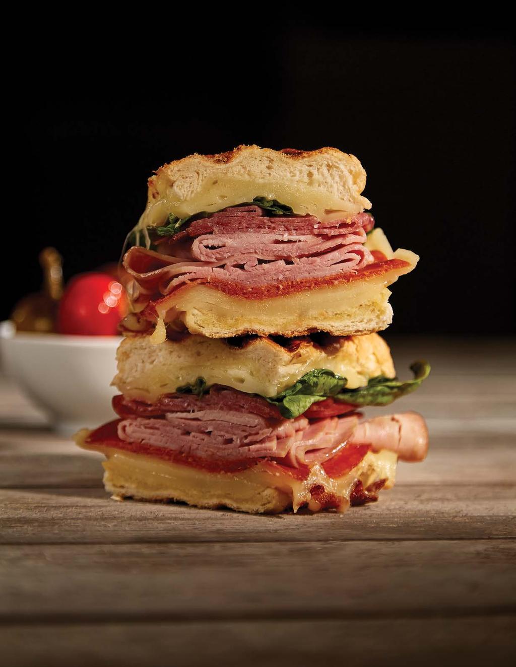 SERVES 2 2 hoagie rolls, sliced in half lengthwise ¼ cup margarine ½ cup baby spinach 8 slices tomatoes, thin ¼ lb. pepperoni, sliced ¼ lb. salami, sliced ¼ ham, sliced ¼ lb.