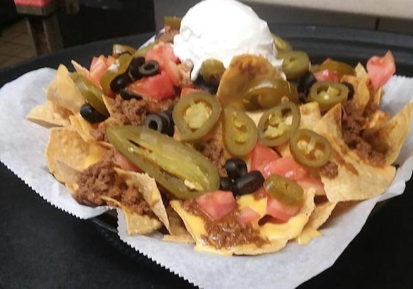99 Seafood Nachos Creamy crab & lobster cheese sauce topped with olives, tomatoes, & sour cream $9.