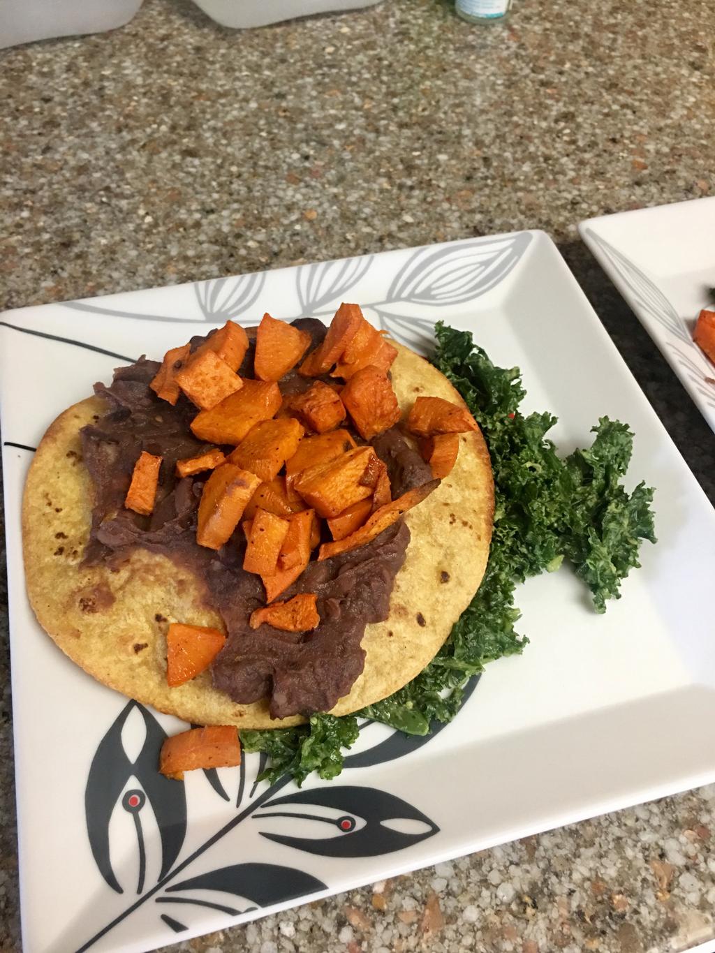 PLAY VIDEO Sweet Potato & Black Bean Tostadas 3 sweet potatoes (peeled and cubed) 2 tbsp Olive Oil 1/2 tsp chili powder Sea Salt 1 can refried black beans 8 corn tortillas 1 tbsp olive oil for