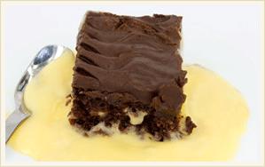 Chocolate Fudge Cake with Custard Smooth, creamy custard compliments this moist chocolate fudge cake.