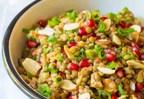 Makes 8 servings 10 cups vegetable broth 3 cups dried green lentils 2 cloves garlic, minced 1 1/2 cups pomegranate arils (1 pomegranate) 1 cup almonds, sliced and toasted 1 1/2 cups green onions,