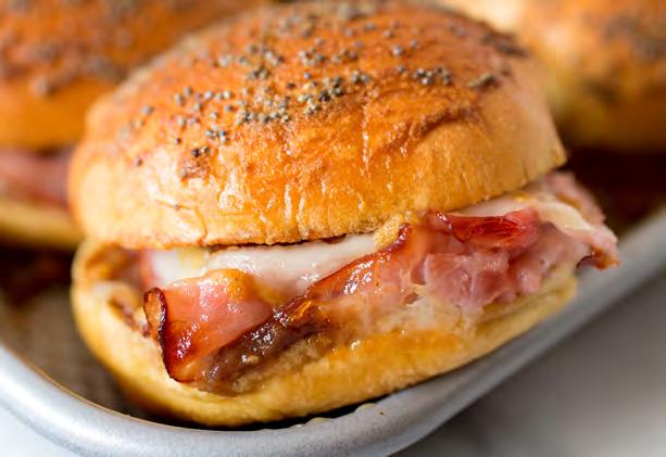 Makes 12 servings 12 slider-size potato rolls 9 thin slices Swiss cheese ½ cup MUSSELMAN S Apple Butter 2 teaspoons whole grain mustard ½ pound smoked deli ham, thinly sliced 5 tablespoons unsalted