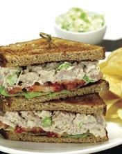 LUNCH Bistro Market Mixed greens or Caeser salad with trio of half sandwiches, fresh cut fruit, selection of chips and
