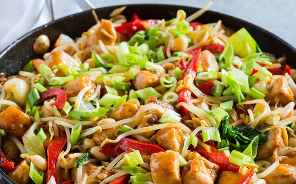 Stir in the chicken; cook and stir until the chicken is no longer pink, about 5 minutes. Remove the chicken from the wok, and set aside.